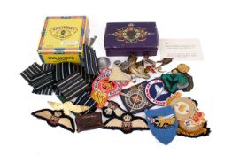 A collection of post-war military patches and badges.