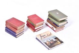 A collection of assorted books related to military history.