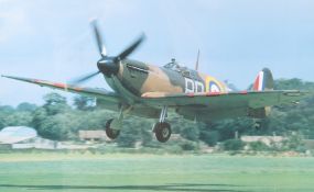 A vintage colour photo of a Spitfire landing. 33cm x 53cm, framed and glazed, 52cm x 72cm.