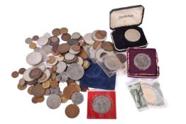A collection of assorted coins, in a tin.