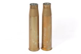A pair of trench art style artillery shells converted into umbrella stands.