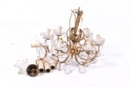 A gilt metal five branch chandelier. Having leaf decoration. Diameter 49cm, with two wall lights.