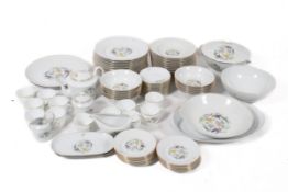 A large French, Porcelain De Limoges dinner service for twelve, decorated with birds.