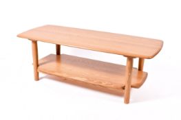 Ercol Windsor coffee table. Having under tier with turned supports.