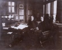 First Remembrance Day 11th November 1919, a large photograph of two men in a office setting.
