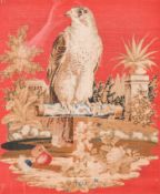 Embroidery picture of a hawk on a perch.