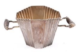 An Art Deco fan shaped silver plated ice bucket with antler handles.