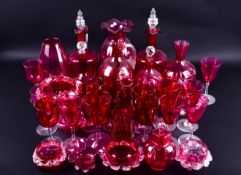 A large collection of assorted Victorian cranberry glassware. Including vases, decanters, etc.