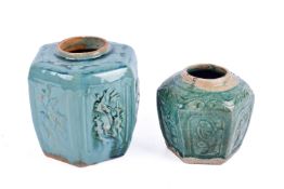 Two Chinese Shiwan ware pottery vases with green glazes. Of hexagonal form with moulded decoration.