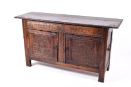 Antique oak sideboard. Having fitted two doors with replacement top and modifications.