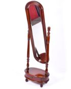 A modern mahogany cheval full length mirror. Raised on a stand with a drawer.