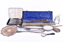 A quantity of assorted silver plate. Including a three piece carving set, a toast rack, etc.