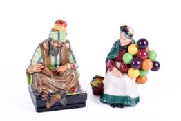 Two Royal Doulton figures. Consisting of 'The Old Balloon Seller' HN 1315 and 'Cobbler' HN 1706.
