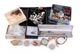 A small group of costume jewellery, wristwatches and loose coins.