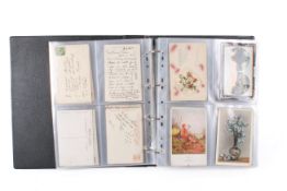 A good collection of early 20th century postcards in an album.
