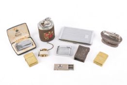 A small group of cigarette lighters and smoking related items.