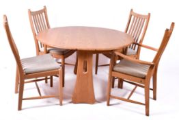 Ercol Windsor gateleg dining table and four chairs.