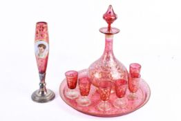 A Bohemian Moser style cranberry glass drinks set.