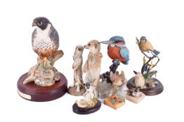 A group of assorted figures, mostly modelled as birds.