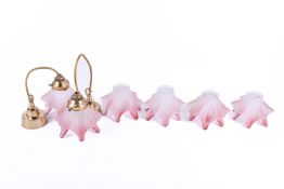 A set of six pink and white ruffled glass lamp shades, comes with two fittings.