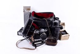 A vintage Praktica SLR film camera S/n 123274 and accessories. With a Carl Zeiss Jena Tessar 2.