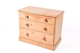 A 20th century Victorian style pine chest of drawers.