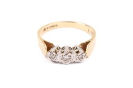 An 18ct gold, three stone diamond ring.