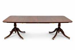 Mahogany extending Regency style dining table with two leaves. H74cm x W252cm x D117cm (extended).