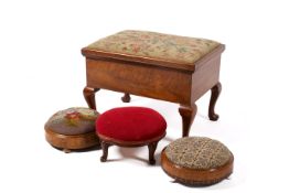 Four assorted upholstered top footstools.