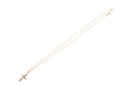 A yellow metal chain necklace and cross. The chain marked 9K, the cross unmarked but testing 9ct.