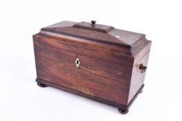 Early 19th Century mahogany tea caddy. Of rectangualr form raisd on bun feet.