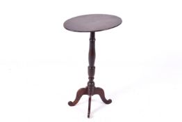 A Georgian mahogany wine table with oval top.