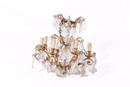 A 20th century French Louis XV style gilt metal and cut glass chandelier.