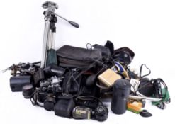 Collection of assorted vintage film cameras and photographic equipment.
