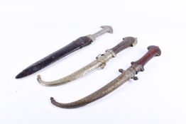 Two Moroccan Koummya style daggers with jabiya curved blade plus another. Largest total 42cm long.