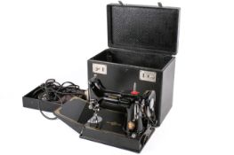 Mid-century Singer 221K lightweight portable electric sewing machine in original fitted case.