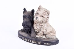 A painted plaster 'Black & White' whisky advertising Scottie dogs.