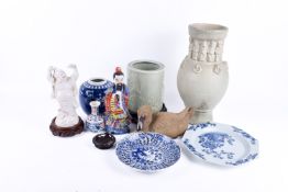 A collection of assorted Chinese pottery pieces. Including a duck, a blue and white ginger jar, etc.