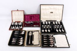 A group of vintage boxed sets of silverplated items.