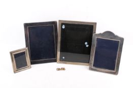 Four silver mounted picture frames and a pair of cufflinks.