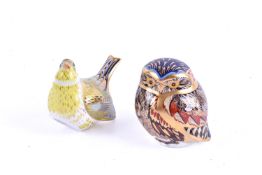 Two Royal Crown Derby porcelain paperweights, with silver stoppers.