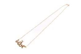 A yellow metal pendant necklace. With Arabic script pendant, the chain marked star/288 AR, and 750.