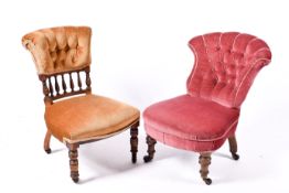 Two Victorian button back upholstered nursing chairs. Each raised on turned front supports.
