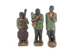 Three vintage painted stoneware musicians.