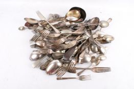Collection of assorted plated flatware. Including a large ladle, spoons and forks, etc.