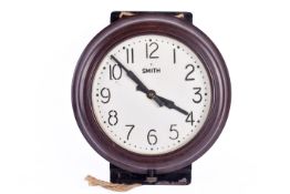 Bakelite wall clock, 'Smiths'. Having Arabic numerals and clockwork mechanism.