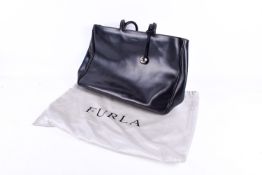 A Furla woman's black leather shoulder handbag with dust bag.