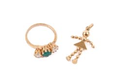 A hallmarked 9ct gold three stone ring and 9ct hallmarked dolly pendant.