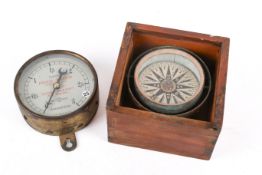 A vintage German pressure gauge by Fried Krupp and a cased gimble mounted compass.