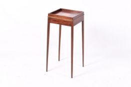 An Edwardian inlaid mahogany side table. Having slender and tapering supports.